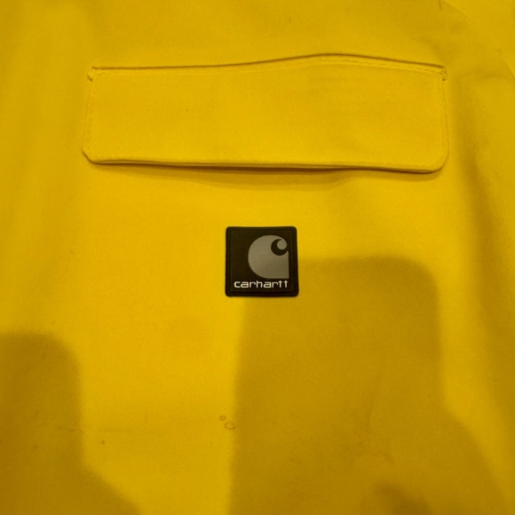 CARHARTT rain coat XL. Husband was a 2XL and it fit him! - Picture 2 of 5